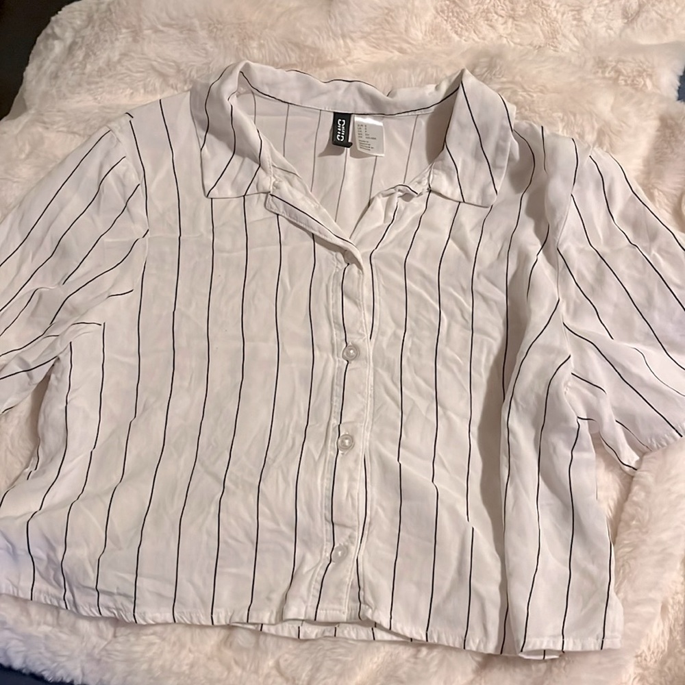 striped black and white shirt.